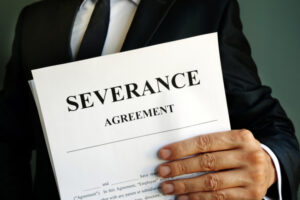 manager is holding severance agreement papers